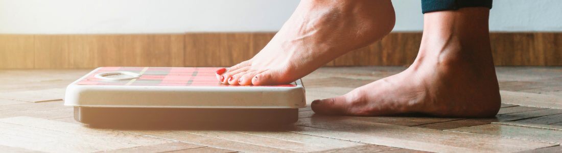 Bathroom scales measuring weight loss