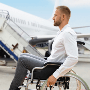 Disabled traveller with CRPS next to plane